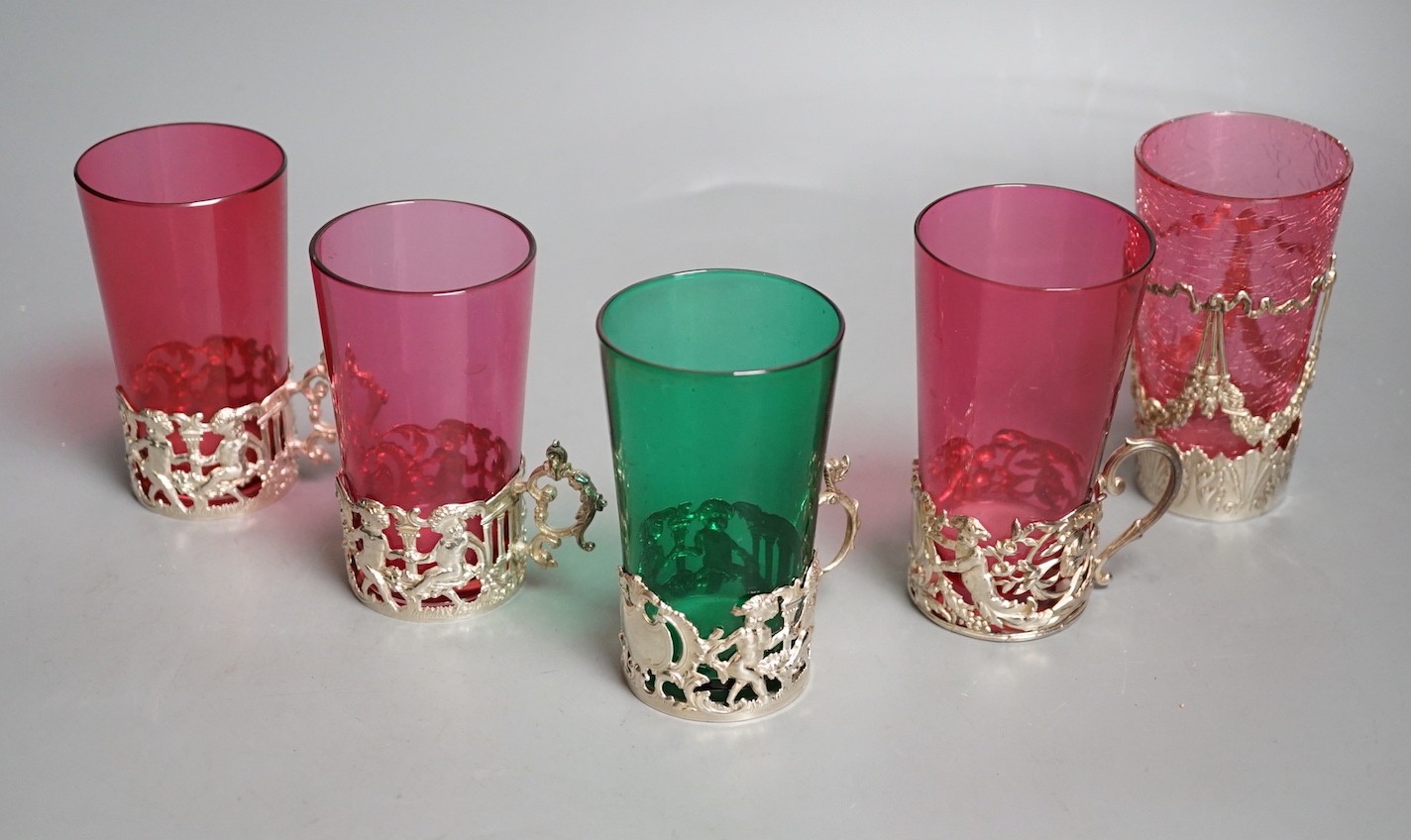 Five silver mounted glass tea holders - 9.5cm tall